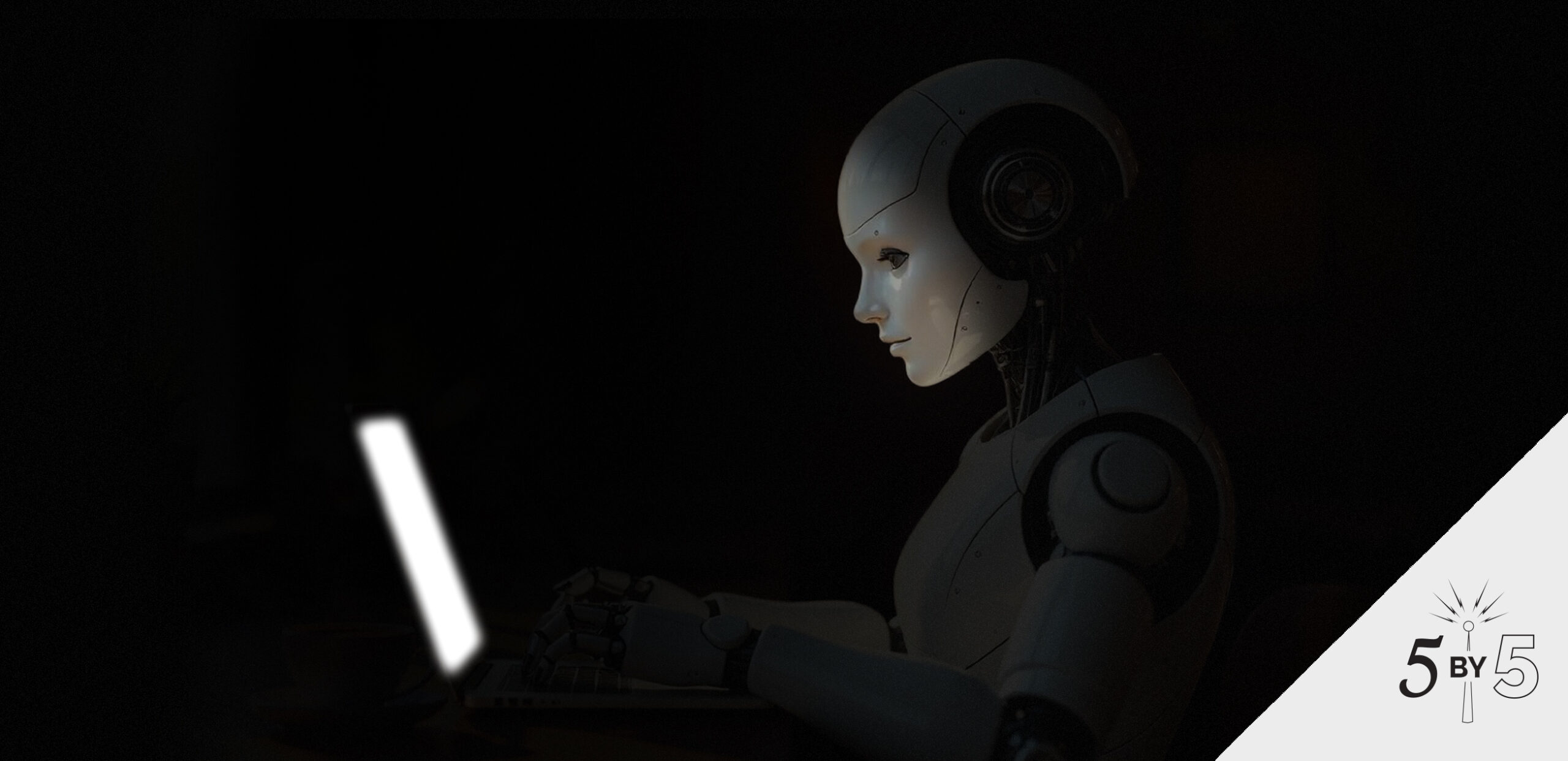 aB_Blog_JUN_25_R1 Robot in front of a laptop with a glowing screen